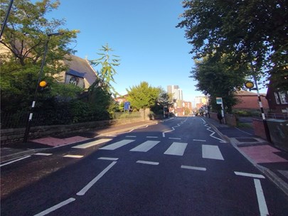 A photo of Weston Grove Road after the installation of the new zebra crossing. St Mark's Church is to the left and Woolston Community Centre to the right, with Centenary Quay in the distance in the centre.