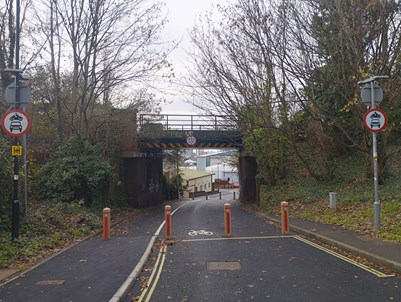 A photo of Sea Road looking down the hill toward the Railway Bridge after the works have been completed and the traffic filter installed.
